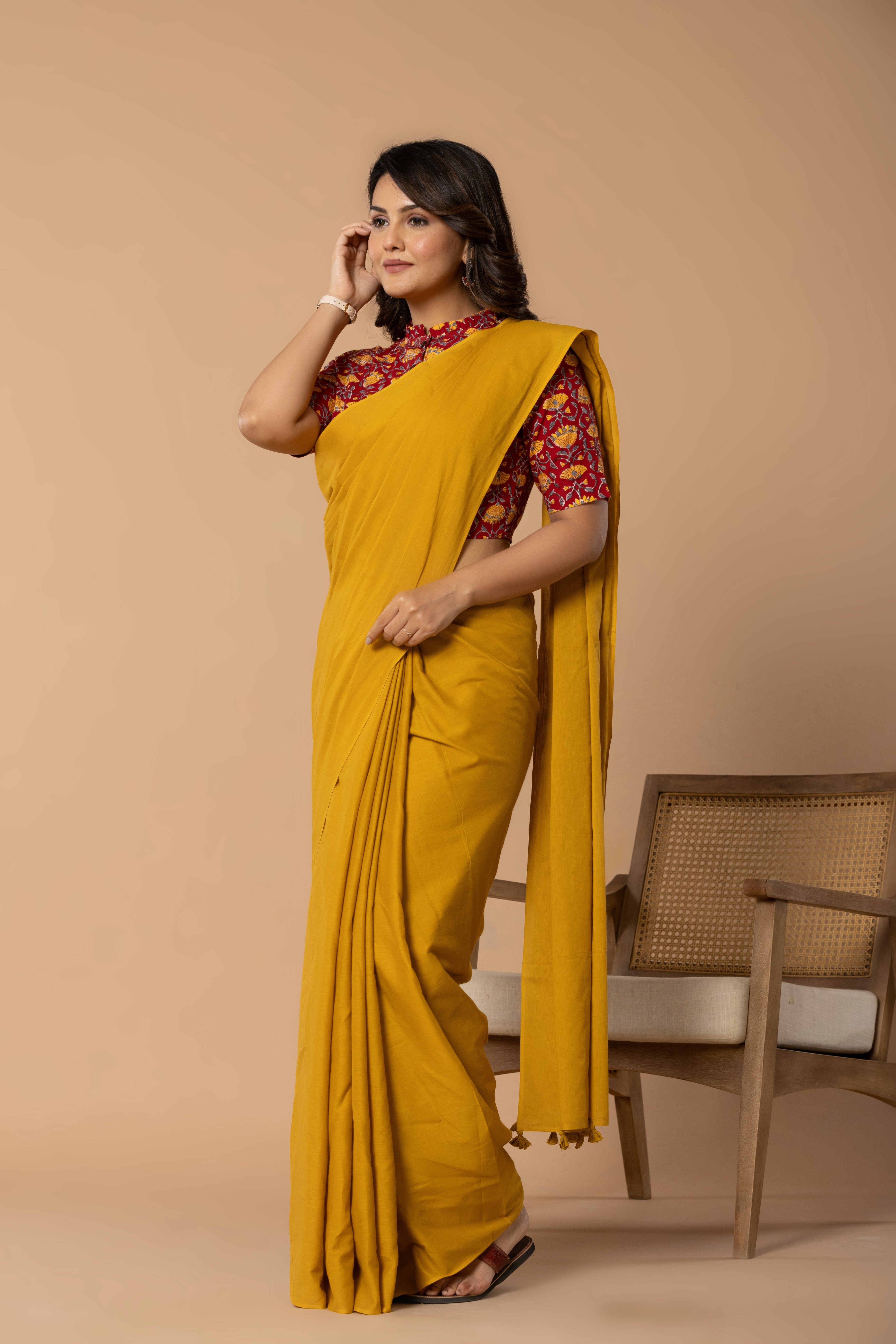 Earthy Yellow Plain Dyed Mul Mul Cotton Saree with Tassels (without Blouse)