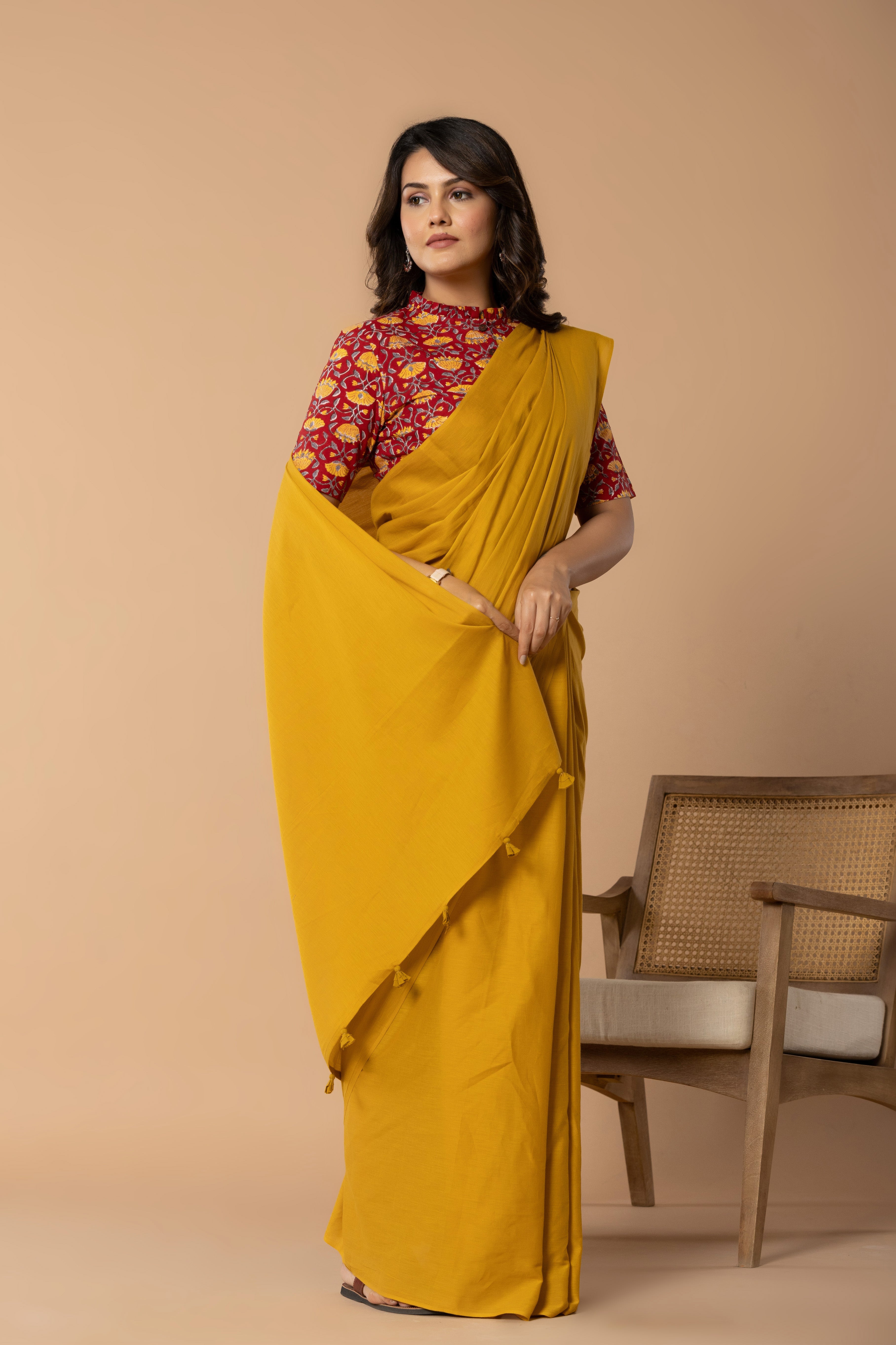 Earthy Yellow Plain Dyed Mul Mul Cotton Saree with Tassels (without Blouse)