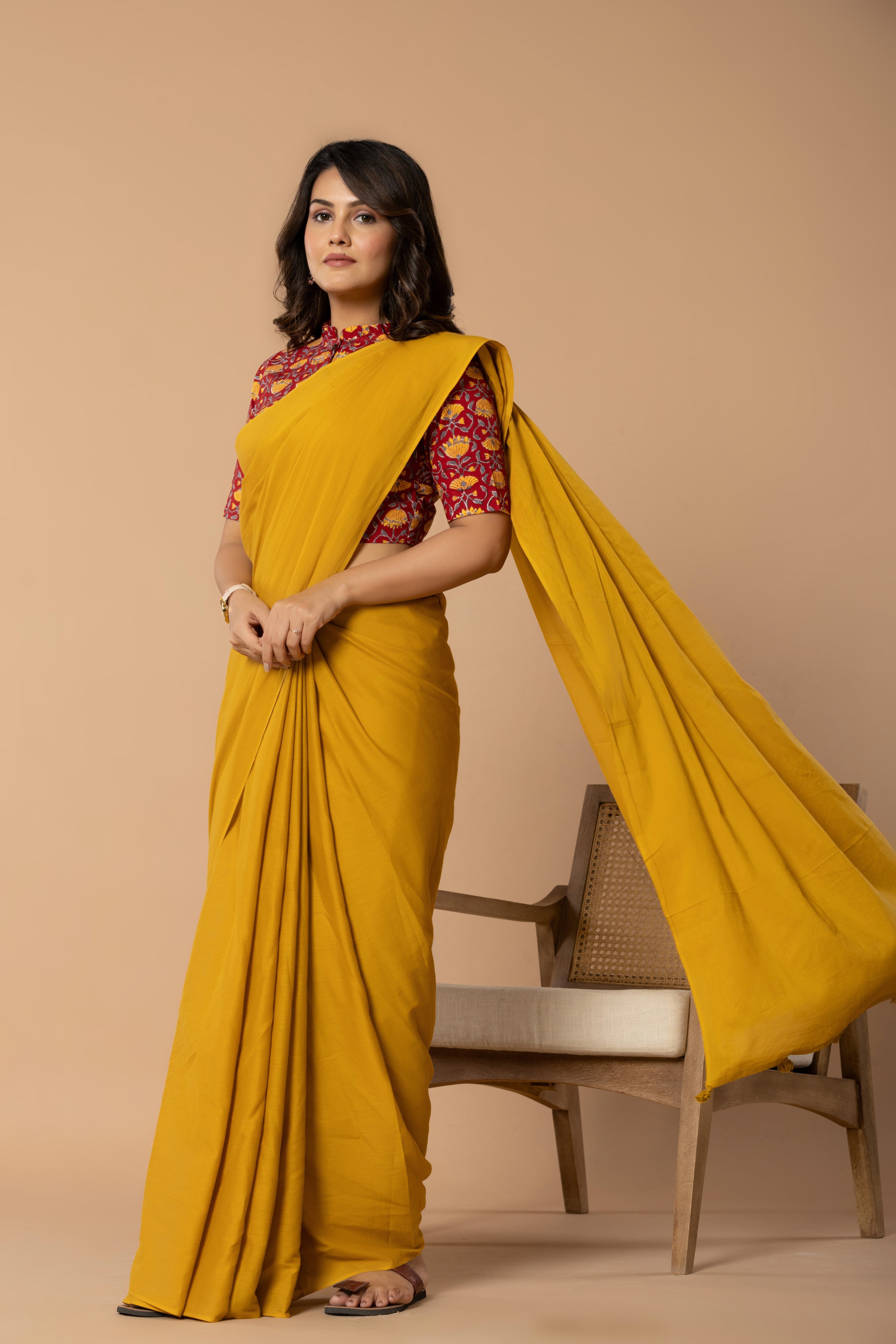 Earthy Yellow Plain Dyed Mul Mul Cotton Saree with Tassels (without Blouse)