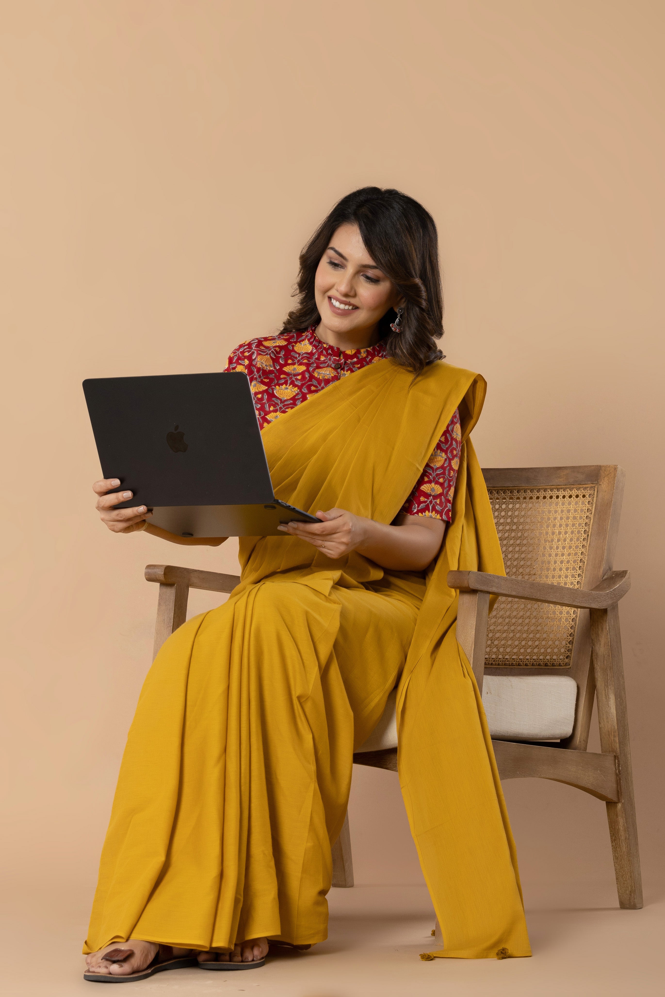 Earthy Yellow Plain Dyed Mul Mul Cotton Saree with Tassels (without Blouse)