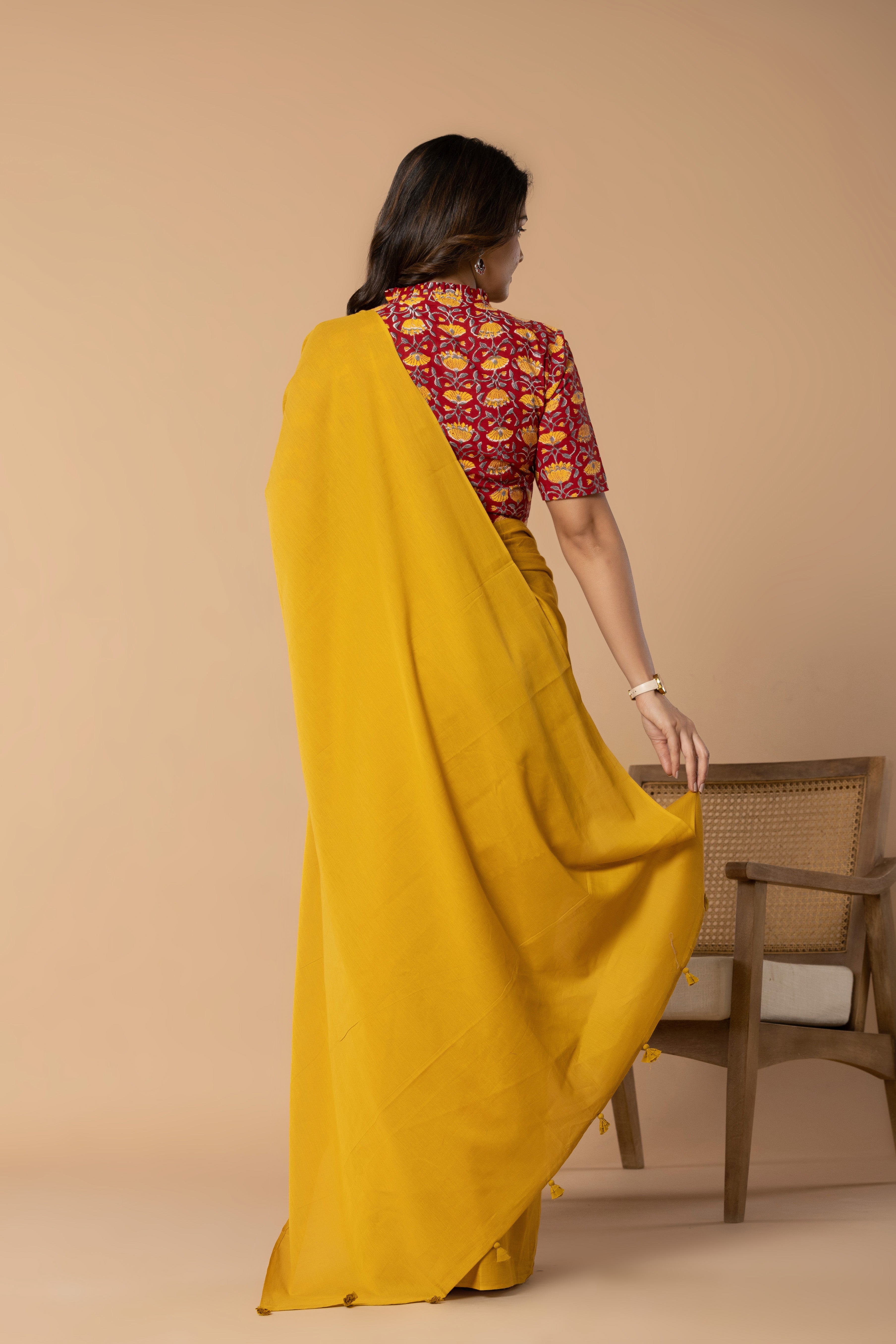 Earthy Yellow Plain Dyed Mul Mul Cotton Saree with Tassels (without Blouse)