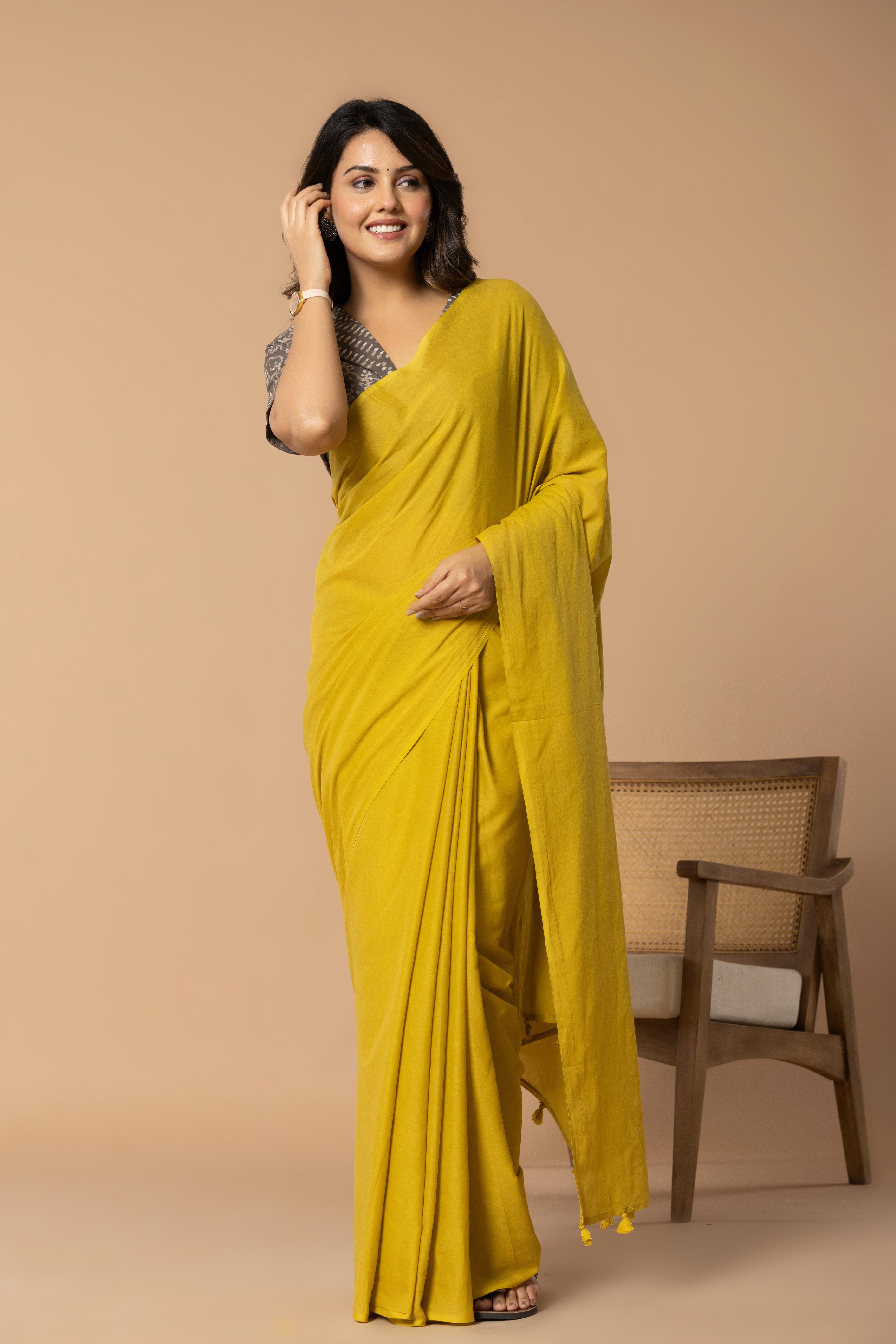 Rustic Yellow Plain Dyed Mul Mul Cotton Saree with Tassels (without Blouse)