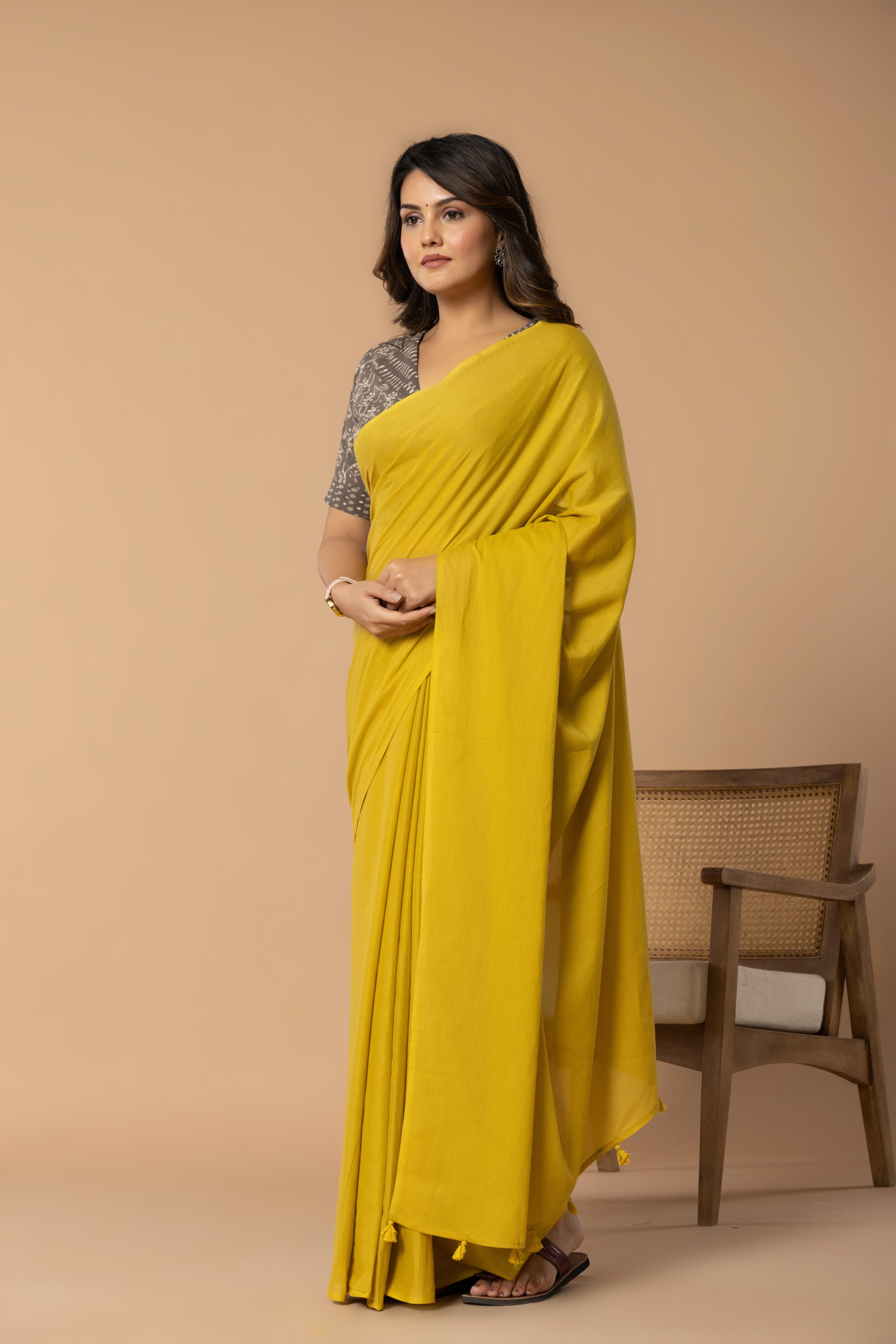 Rustic Yellow Plain Dyed Mul Mul Cotton Saree with Tassels (without Blouse)