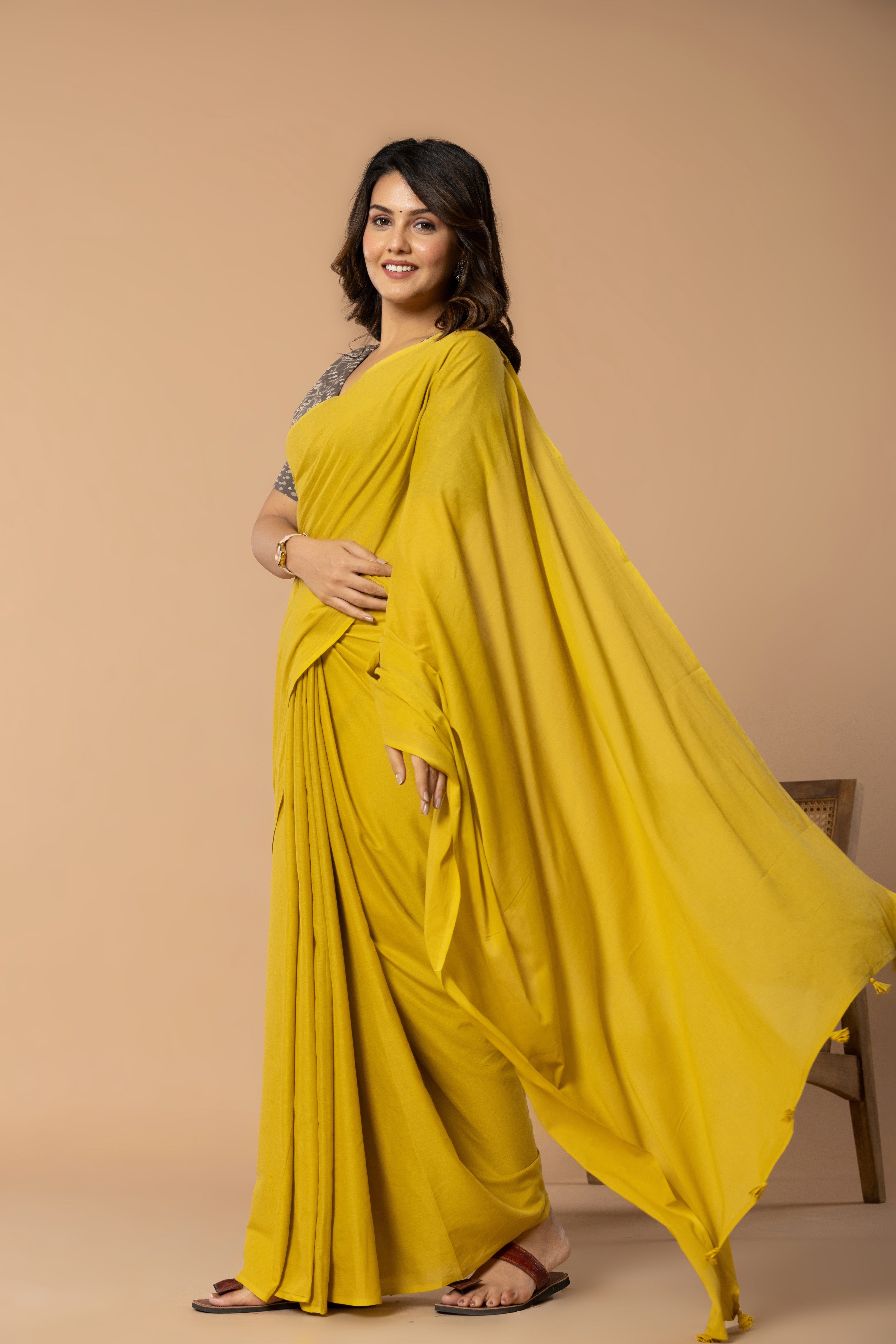 Rustic Yellow Plain Dyed Mul Mul Cotton Saree with Tassels (without Blouse)