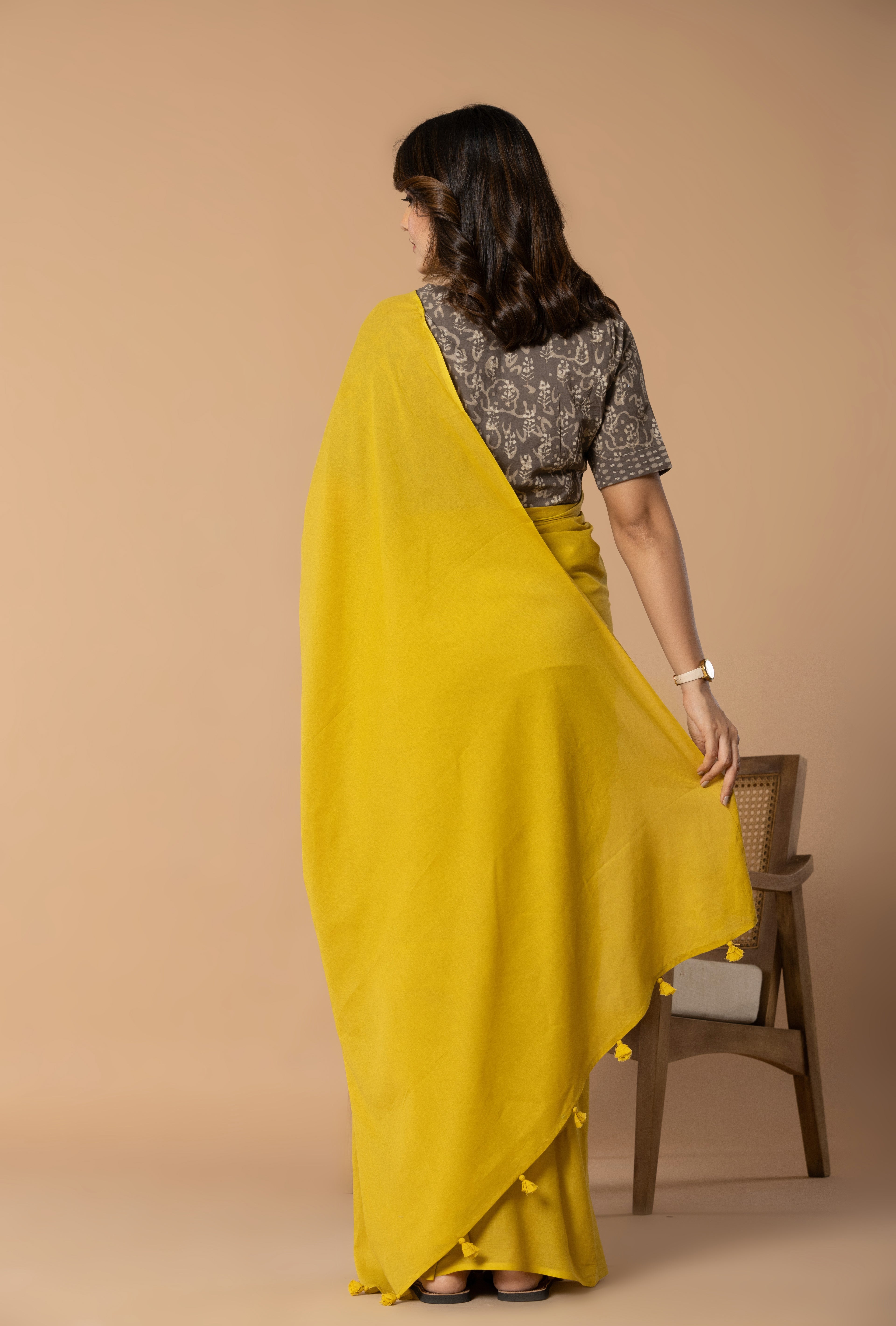 Rustic Yellow Plain Dyed Mul Mul Cotton Saree with Tassels (without Blouse)