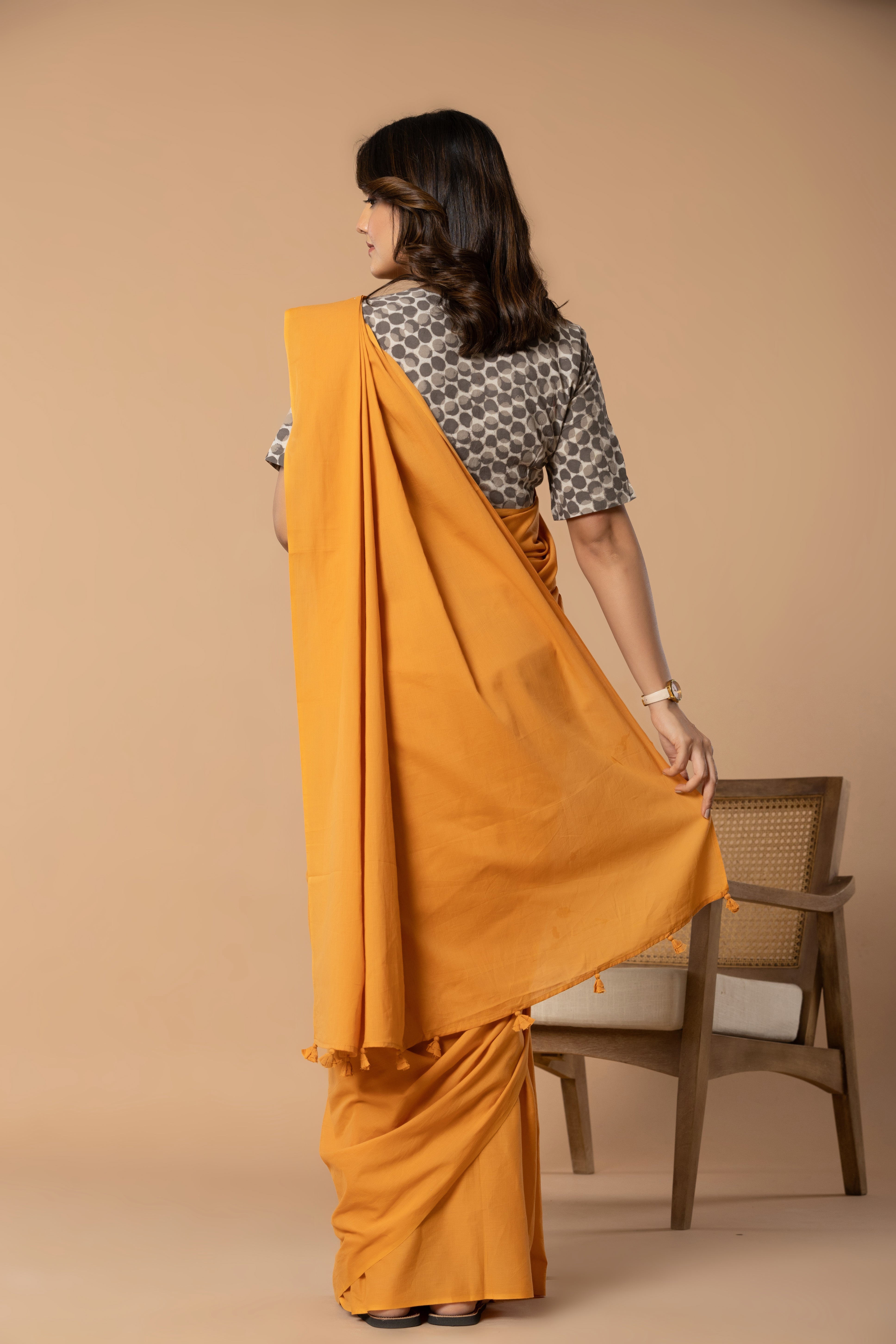 Sun Orange Plain Dyed Mul Mul Cotton Saree with Tassels (without Blouse)